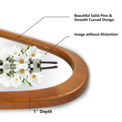 Miroir mural asymétrique en forme de galet avec cadre en pin.