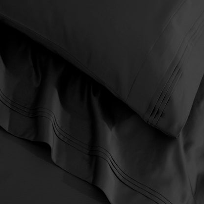 Jeu de draps uni en coton égyptien supérieur, 1500 fils, avec profonde poche.